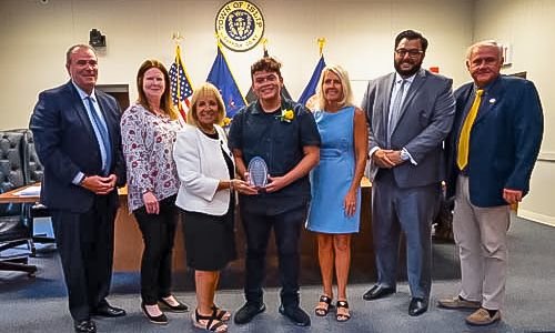 (From L to R) Councilman Jim O’Connor, town clerk Olga Murray, town supervisor Angie Carpenter, Hispanic Heritage Month nominee Alberto Melgar, councilwoman Mary Kate Mullen, Brentwood School District trustee Hassan Ahmed, and councilman John Cochrane.
